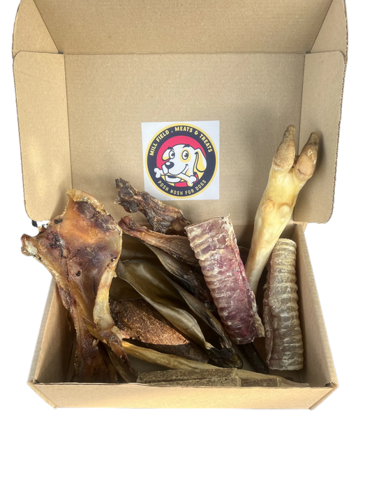 The Tail Wagger Treat box , 2 large beef ears ,3 beaf beams, 2 beef trachea, 1 puffed beef jerky, 3 venison gourmet sticks ,1 buffalo tail , 2 camel skins,  1 moon beam ,  Packed with all the chewy